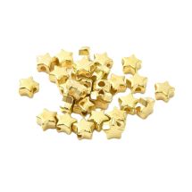 Synteettinen helmi sileä minitähti kullanvärinen 5,5x6 mm n. 25 kpl